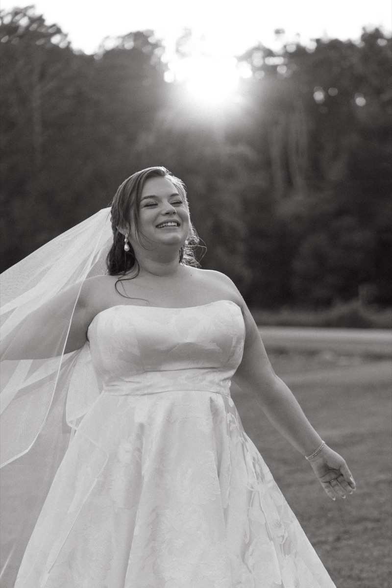 Bride spinning in her dress in black and white
