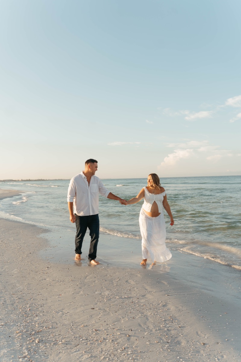 Couple walking along the beach