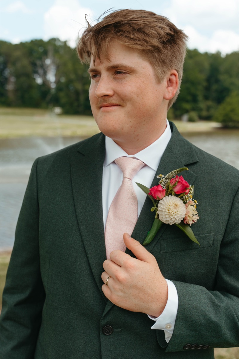 Groom smiling before the ceremony
